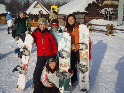Girls with their snowboards